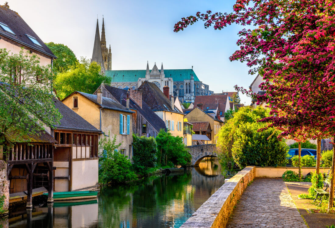 Eure River embankment with old houses in a small town Chartres, France
